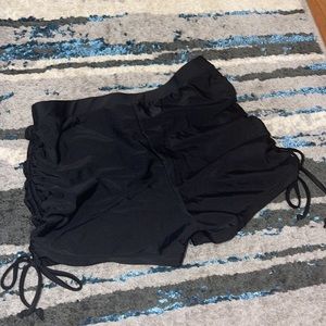 swimsuit material shorts. short swimsuit bottoms. adjustable legs. black size M